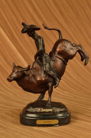 Frederic Remington Cowboy Bullenreiten Rodeo Bronzeskulptur Marmorsockel Bild