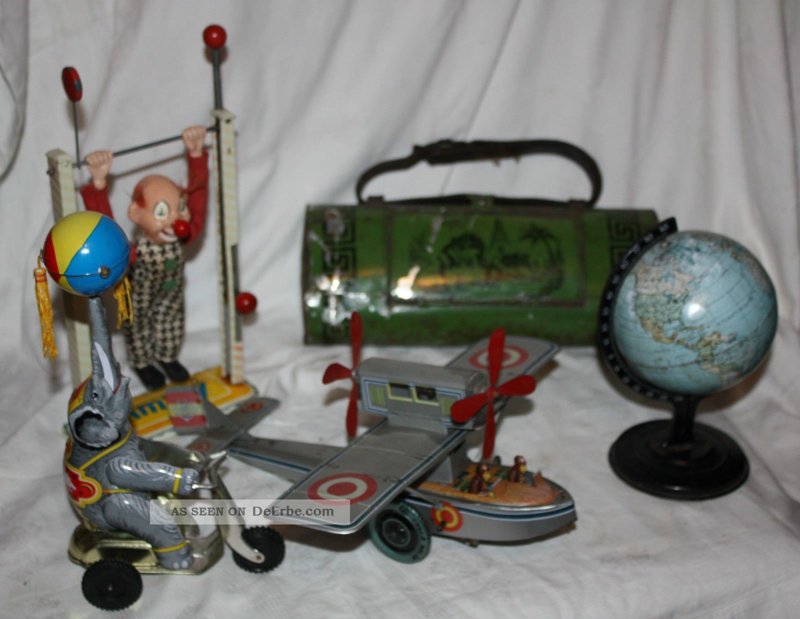 Blechspielzeug Konvolut,  Arnold Jimmy,  Flugzeug,  Elefant,  Botanisier Dose,  Globus Original, gefertigt vor 1945 Bild