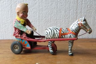 Antikes Blechspielzeug Clown Auf Einspänner Mit Zebra Zum Aufziehen Bild