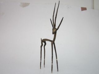 Skulptur Gazelle,  Springbock,  Gelbguß,  Fragile Darstellung,  Burkina Faso,  Afrika Bild