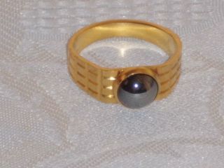 Goldener Ring Mit Perle Bild
