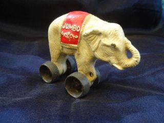 Antikspielzeug Elefant Figur Auf Rädern Jumbo Spardose Aus Gußeisen Bild